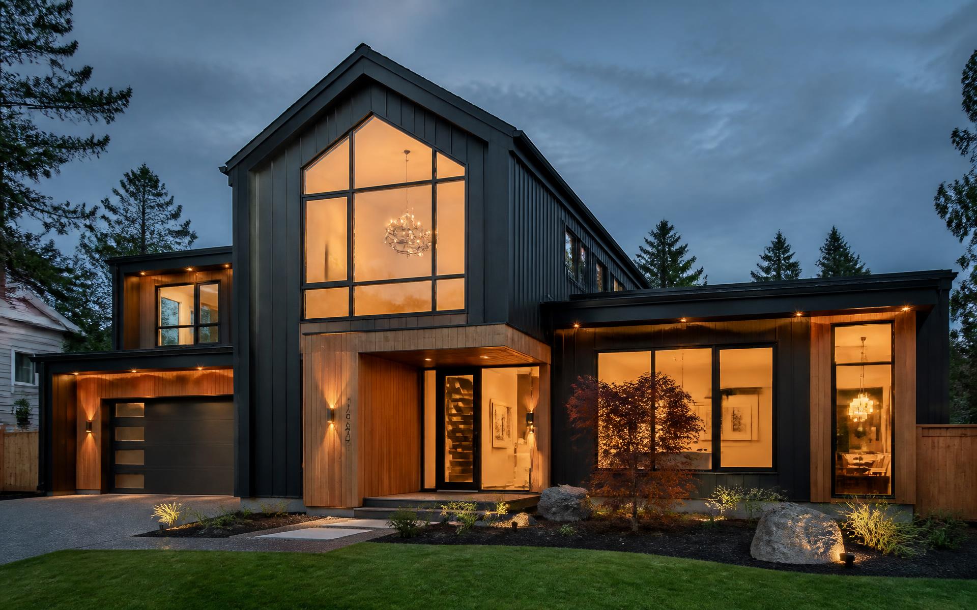 Modern renovated home at dusk built by AYMA HOMES